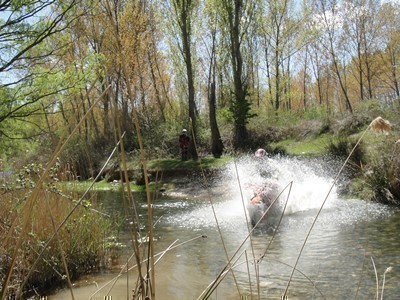 Crossing a river in Aragon on a KTM enduro tour
